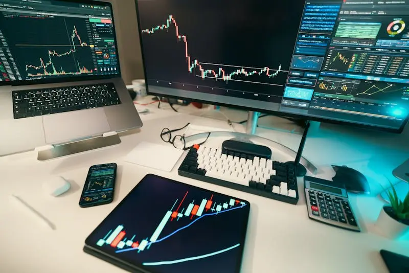 Trading desk with multiple screens displaying derivatives pricing and options data